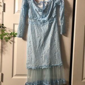 Light blue. Off the shoulder with mesh in the middle and bottom. Lace material